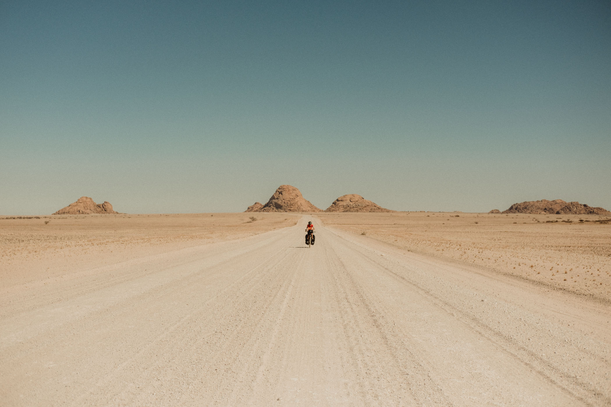 Karaban pedaling in the middle of the desert